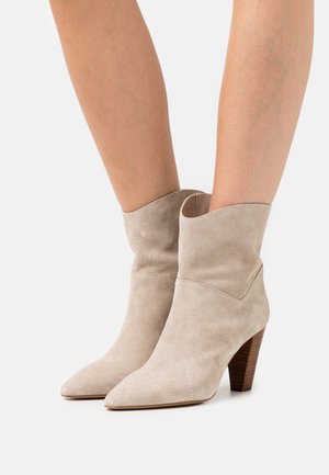 San Marina Biker-/cowboynilkkurit - beige