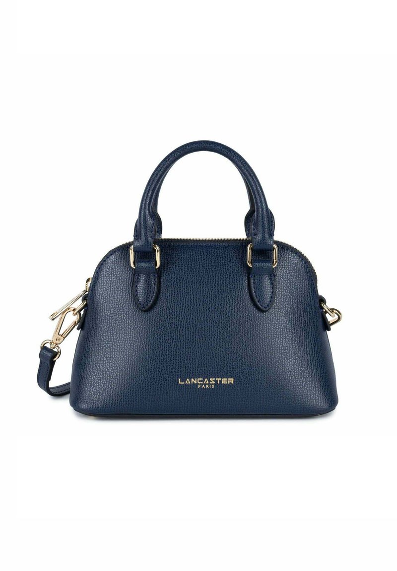 Piccola borsa a mano in pelle blu navy con finitura testurizzata, doppi manici superiori, tracolla staccabile e accento logo oro sulla parte anteriore.