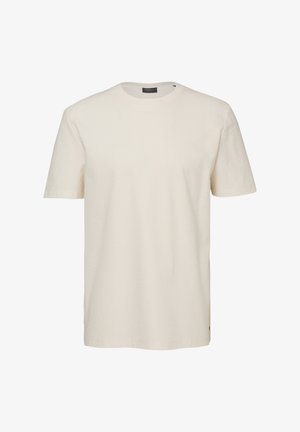 T-shirt basique à manches courtes et col rond, couleur écru, avec un tissu à texture subtile, présenté sur fond blanc.