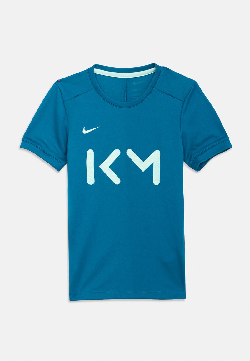 Camiseta de manga curta Nike cor verde-azulado com um grande logótipo branco "KM" na frente, feita de tecido leve e respir�ável com decote redondo.