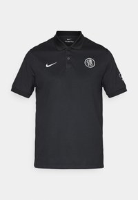 Sort kortærmet polo-shirt lavet af glat stof, med en knaplukning med to knapper og et rundt logo på venstre bryst. Hvid Nike swoosh akcent.