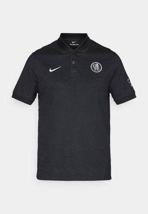Polo shirt nero a maniche corte realizzato in tessuto liscio, con colletto a due bottoni e un logo rotondo sul lato sinistro del petto. Accento con il logo Nike bianco.