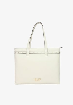 Borsa a tote bianca in pelle con due manici, dettagli in metallo dorato e una fila decorativa di piccoli chiodi lungo il bordo superiore. Logo visibile sulla parte anteriore.