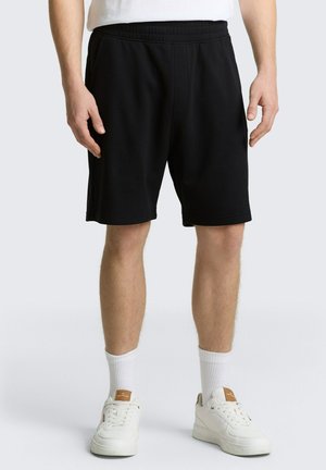 - Spodnie treningowe