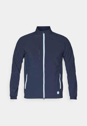 Navy jacket with a textured fabric, full zip front, contrasting light blue zip details, and two side pockets. Round logo at the bottom left.