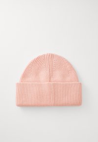 Knit pink beanie with folded brim, showing ribbed texture, displayed flat on a white background.