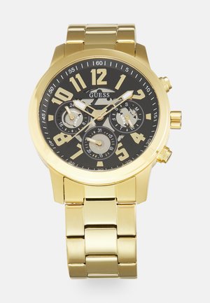Goldene Uhr mit schwarzem Zifferblatt, großen arabischen Ziffern, Chronographen-Subdials und einem goldenen Metallarmband. Verfügt über eine glatte, glänzende Oberfläche.