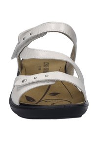Silver sandal with two adjustable straps, Velcro closures, and a textured footbed featuring a leaf pattern. Black outsole for stability.