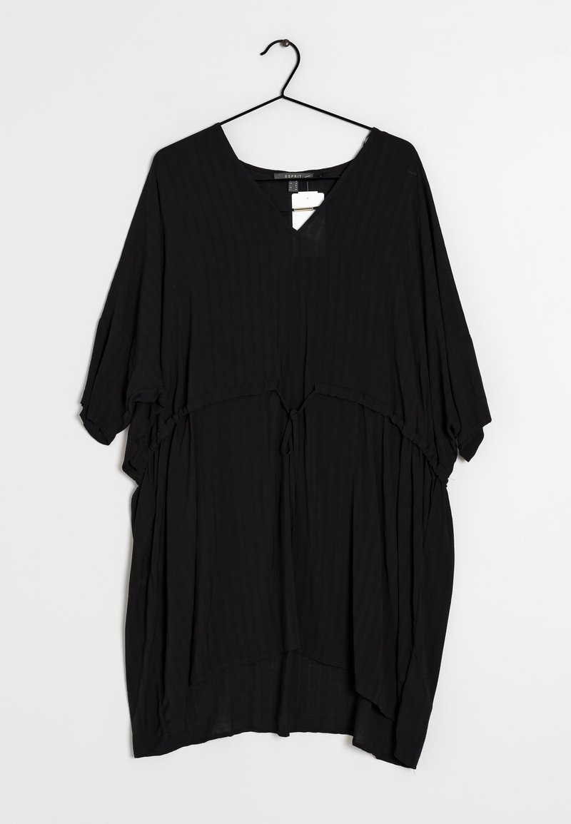 Top nero dalla vestibilità ampia con scollo a V e maniche corte, caratterizzato da un dettaglio con fiocco in vita e un tessuto texturizzato a costine.