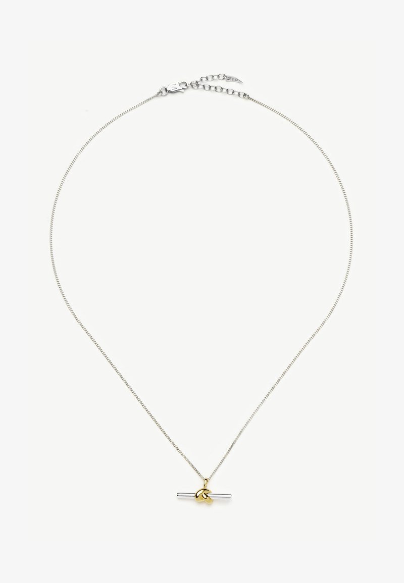 Collier délicat en chaîne argentée avec un pendentif barre horizontale en argent souligné par un petit détail de feuille dorée au centre.