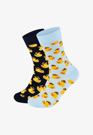 Bawełniane skarpetki w kolorze granatowym i jasnoniebieskim, z powtarzającym się wzorem żółtych gumowych kaczek z czarnymi akcentami. Miękka faktura, długość do połowy łydki.