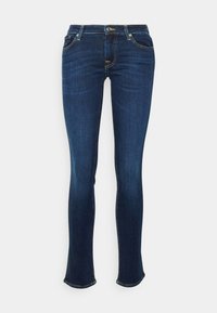 Dark blue denim jeans with a slim fit design, lighter blue stitching, five pockets, and a slight flare at the hem.
