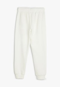Hvide sweatpants lavet af ribbestrikket stof. Elastisk talje og tætsiddende manchetter ved anklerne. Simpelt, minimalistisk design.