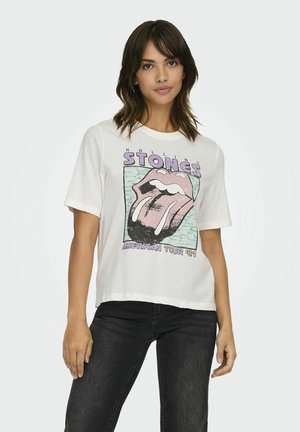 Hvid oversized t-shirt med et grafisk design af en pink tunge og teksten "ROLLING STONES AMERICAN TOUR '81" i lilla.