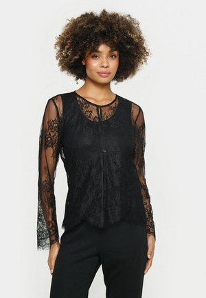 Black lace top featuring long sheer sleeves, floral lace pattern, scoop neckline, and button closure at the front.