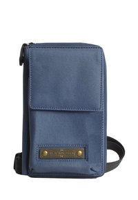 Blue fabric wallet with a zip closure, front pocket flap, and metal logo plate. Features textured material and a slim rectangular shape.