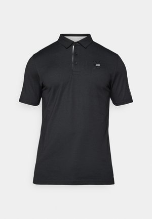 Zwarte poloshirt met een twee-knopen placket, korte mouwen en CK-logo op de linkerborst. Gemaakt van gestructureerde stof met een klassieke fit.
