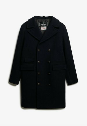 Abrigo de lana azul marino con frente de doble botonadura, gran cuello, dos bolsillos frontales y botones de tono bronce. Textura suave y corte relajado.
