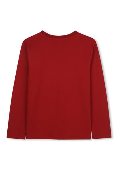 Chemise à manches longues en coton rouge uni. Dotée d'un col rond et d'une coupe droite avec des fentes latérales à l'ourlet. Aucune illustration graphique.