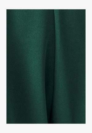 Dark green fabric, smooth texture with a slight sheen, draped softly with gentle folds. No patterns or embellishments visible.