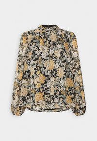 Långärmad blus i svart tyg med gula och vita blommotiv, med hög halsringning och rynkade detaljer fram.