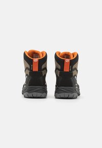 Black and gray hiking boots with a high ankle design, featuring orange accents, a textured upper, and a rugged rubber sole.