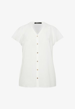 Blouse blanche à manches courtes avec col en V et six boutons sur le devant, avec une étiquette au niveau du col.