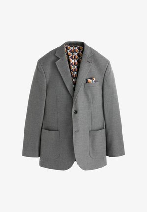 Hallitusseente värvi bleiser kahe esise tõukepotiga, ühe nupuga sulgemine ja mustriline sisetöötlus geomeetriliste kujundite ja värvidega. Taskurätt kaasas.