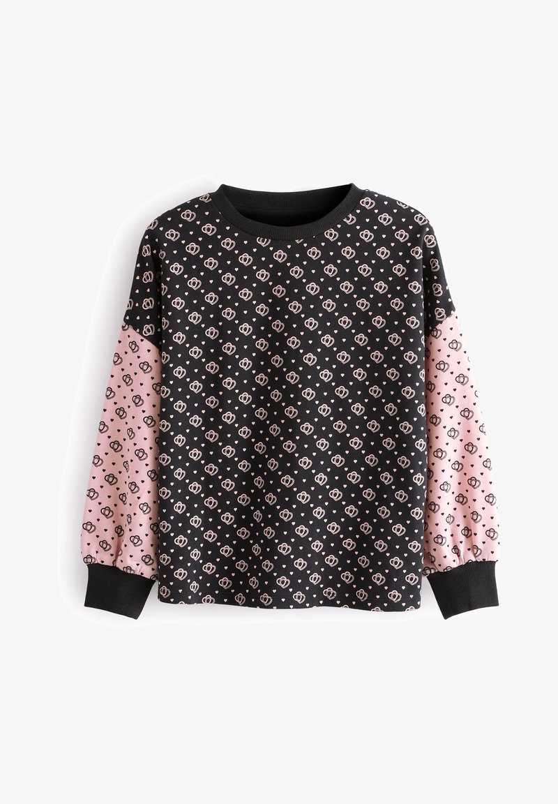 Haut noir à manches longues avec des manches bouffantes roses. Le motif est composé de petits cœurs roses et de visages dessinés. Col et poignets côtelés.