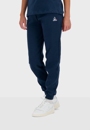 ESSENTIELS - Tracksuit bottoms - navy blue