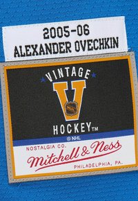2005-06 Alexander Ovechkin hockey jersey label with Mitchell & Ness Vintage Hockey branding on blue fabric.