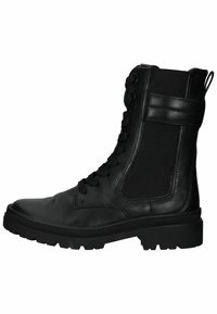 Bottines noires avec un extérieur en cuir texturé, panneau latéral élastique, bout rond et semelle robuste. Comprend des lacets et une languette.
