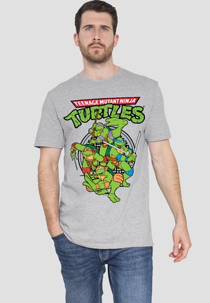 Gray t-shirt featuring a colorful graphic of four cartoon turtles with the text "Teenage Mutant Ninja Turtles" above.