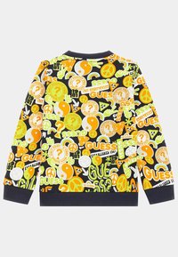 Sweat-shirt avec des graphismes audacieux et multicolores en jaune, vert et orange. Base noire avec différents logos, symboles et motifs. Poignets côtelés.