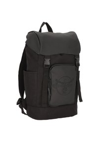 Black backpack with a textured fabric body, rubberized flap, front zip pocket, adjustable straps, and mesh side pockets for added storage.