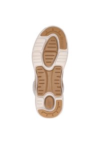 Podeszwa trampków z lekkim, brązowym wzorem z gumy. Zawiera teksturowane wzory, które zapewniają przyczepność i wsparcie. Obejmuje również uformowaną białą podeszwę środkową.