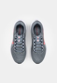 Gray athletic shoes with mesh upper, contrasting pink accents, and rubber soles. Features standard lacing system and padded collar.