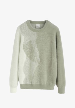 Pull vert clair texturé avec un col rond et des manches longues. Présente un motif dégradé qui passe d'un uni à un effet moucheté. Matière douce.