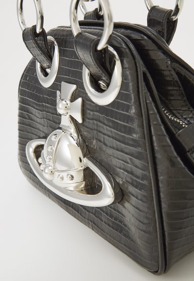 Black leather handbag with a textured surface, silver hardware, and a decorative crown emblem. Features circular handles and a structured shape.