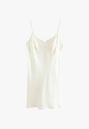 Camisola bianca con spalline regolabili, caratterizzata da un bordo in pizzo nella parte superiore e un tessuto morbido e stretch. Design semplice, taglio alla coscia.