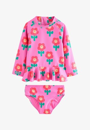 Rózsaszín úszónadrág szett, hosszú ujjú toppal, fodros szélekkel és virágmintával, ami illik a hozzá tartozó bikinialsóhoz, mindez rugalmas anyagból készült.