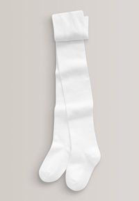 Par lange, hvide, foldede strømpebukser lagt fladt på en lys grå baggrund, der viser fod- og benafsnit.