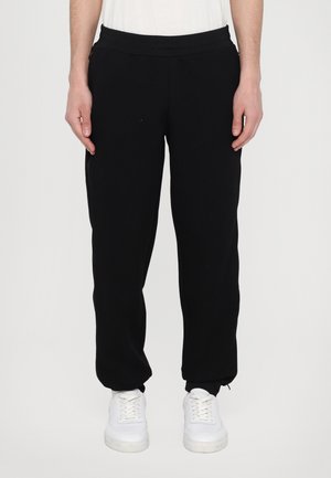 HIDDEN ZIP LOGO TROUSER - Pantalon de survêtement - black
