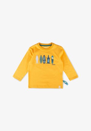 Gelbes Langarmshirt für Kleinkinder mit fünf Surfbrett- und Tiermotiven auf der Brust und einem kleinen blauen Reißverschlussanhänger an der Seite.