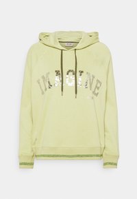 Světle zelená mikina s kapucí, na které je napsáno "IMAGINE" ve stříbrných flitrech. Obsahuje kapuci, šňůrky a třpytivé akcenty na manžetách a spodním lemu. Texturovaná látka.