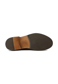Brown leather shoe sole with a smooth texture, contrasting light brown and dark rubber sections, featuring grooves for traction and stamped text.