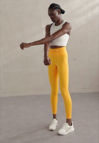 Girlfriend Collective LEGGING LONG - Tajice - golden glow