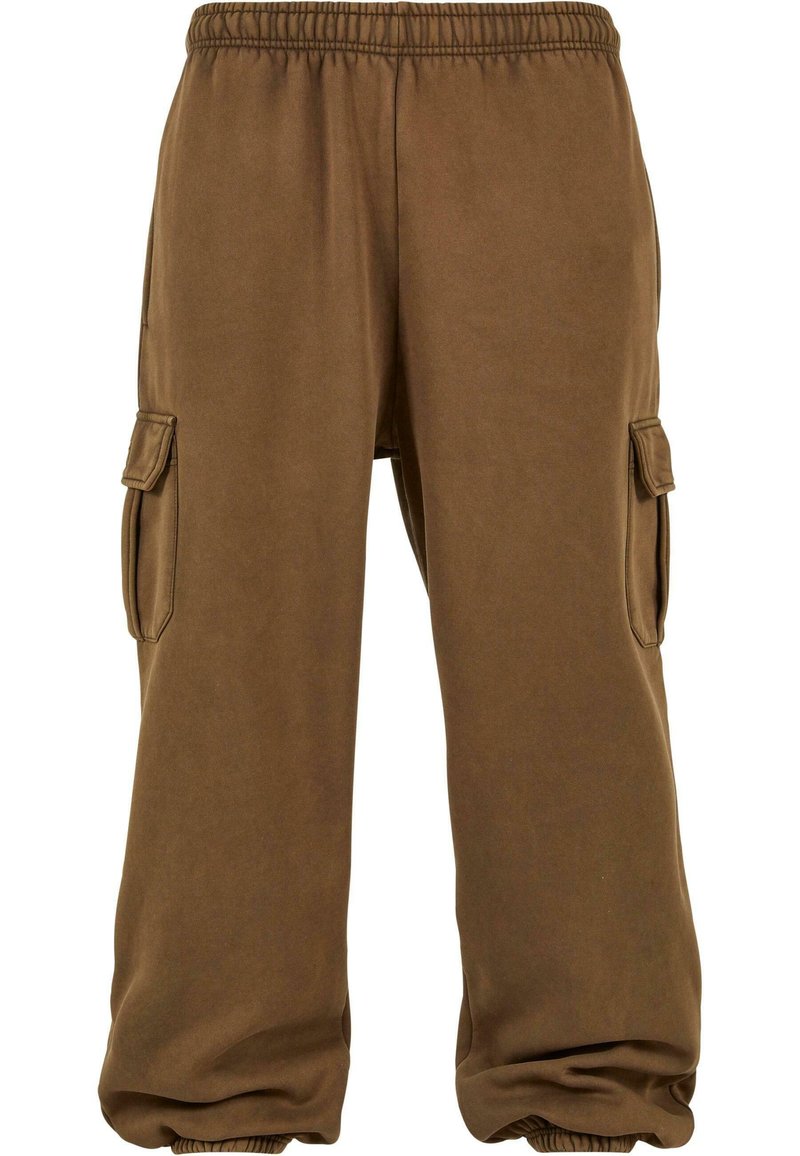 Brune joggebukser laget av mykt stoff med løs passform, med elastisk midje, tapered mansjetter og sidelommer.