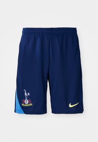 Mørkeblå sportsshorts med lysblå meshpanel på siden. Har broderet holdlogo og gul Nike-logo på højre side.