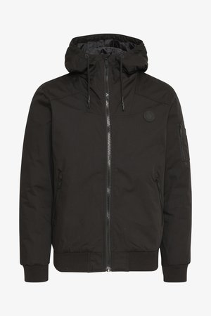 Black jacket with a zip front, adjustable hood, ribbed cuffs, and a patch logo. Made from a smooth, durable fabric with a minimalist design.